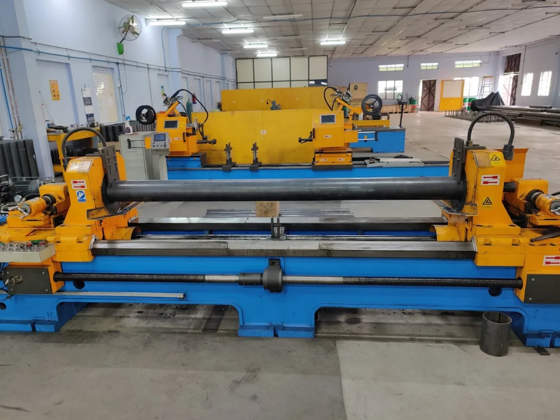 A machine designed for the production of steel pipes, showcasing its industrial functionality and robust construction